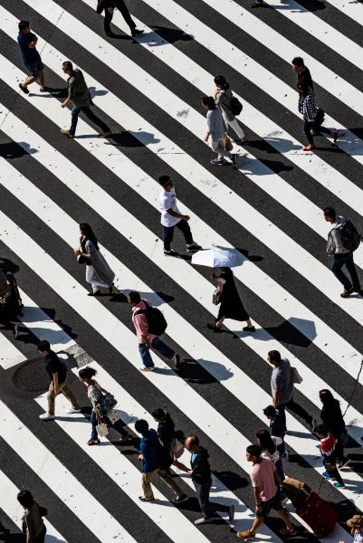 People crossing a zebra crossing
